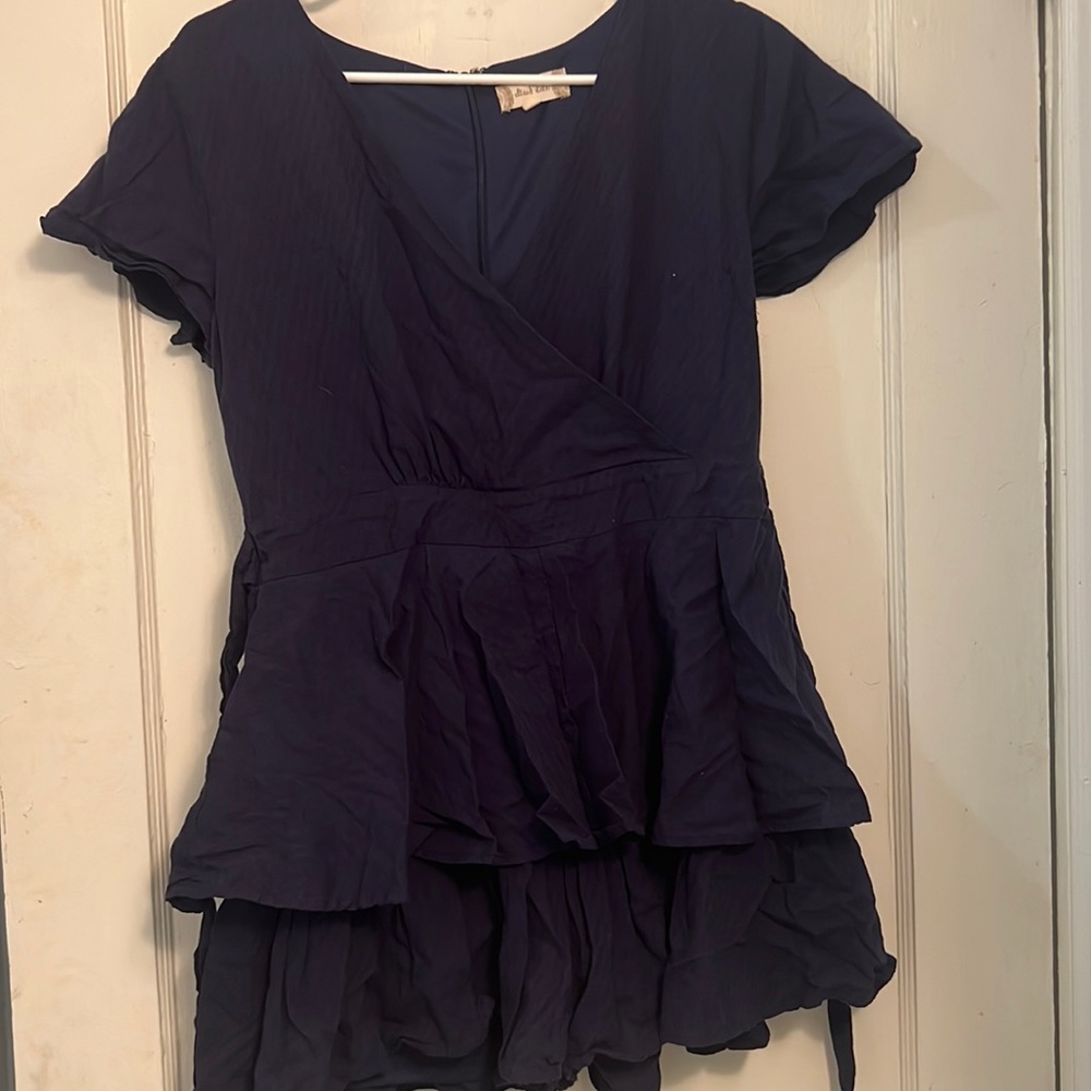 Navy blue ruffle romper. I only wore one time for an event.